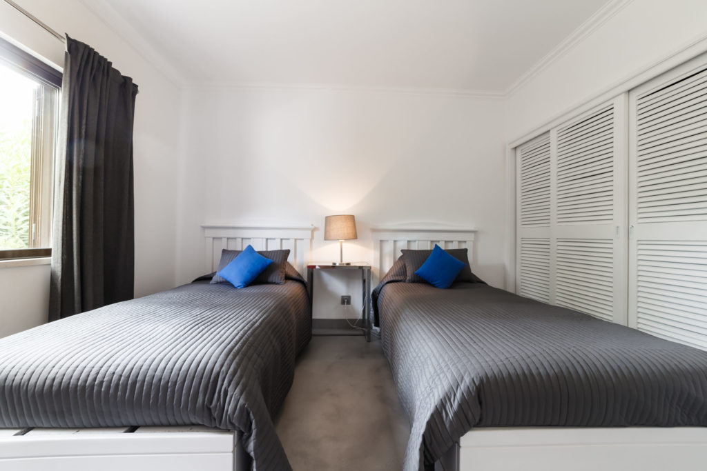 Modern apartment with white walls and light grey floor